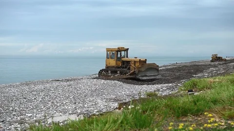 Environmental pollution concept - heavy construction machinery works on seashore Stock Footage 118530219