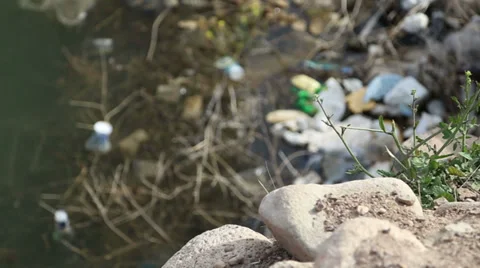 Environmental pollution in dam. focus on from rocks to water Stock Footage 37230123