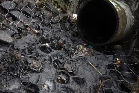 Environmental pollution. engine oil from a pipe Stock-Fotos