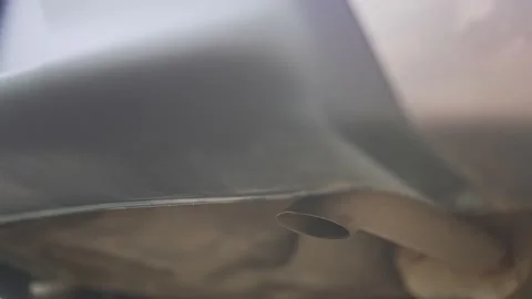 Environmental pollution. The exhaust pipe of a running car. Smoke from the Video stock 196156092