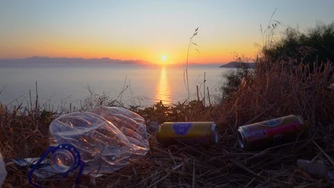 Environmental Pollution With Garbage At A Coastline and Sunset Stock Footage 116446496