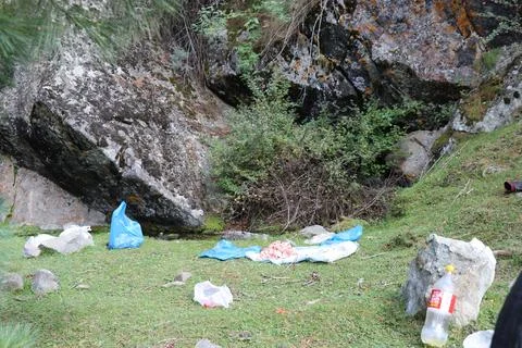 Environmental Pollution: Garbage Left Behind in Scenic Natural Places Stock Photos