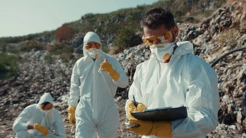 Environmental pollution issue. Team of professional ecologists researching dump Stock Footage 113929939