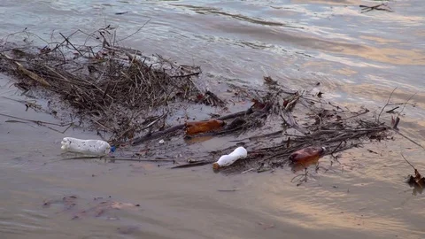 Environmental pollution. The river is carrying garbage after the flood, Uzhgorod Stockbeeldmateriaal 83428945