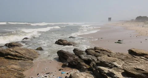 Environmental Pollution trash rocky beach Accra Ghana Africa 4K Stock Footage 157141993