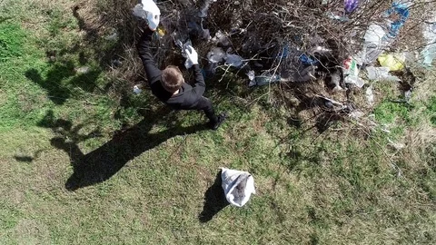 Environmental pollution. trash in the trees. bad attitude to nature. garbage. Stock Footage 126246444