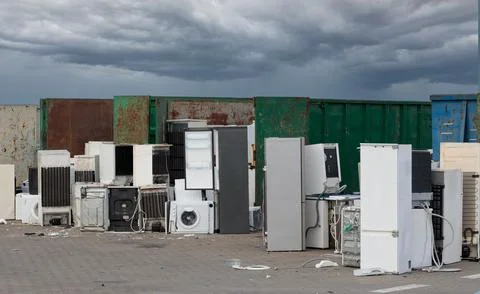Environmental problem, excessive consumerism. Electronics dump on field. Elec Stock-Fotos