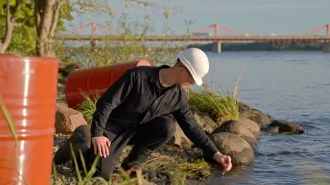 Environmental Scientist Testing River Water for Pollution Contamination Stock Footage 322190182