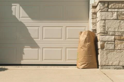 Environmental trash bag in front home for concerning about global warming Stock Photos
