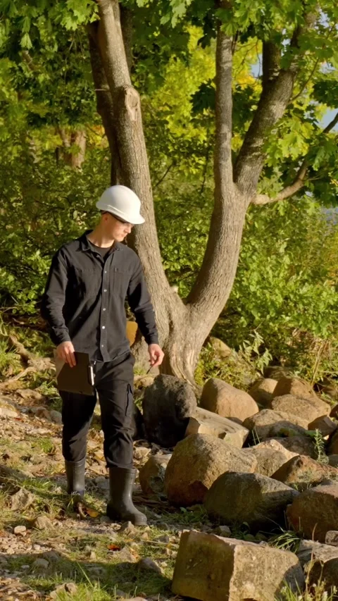 Environmental worker testing water quality in a natural area Stock Footage 321726569