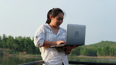 Environmentalist analyzing water test results using application on laptop. Stock Footage 241637616
