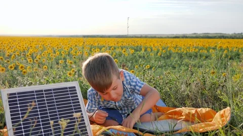 Environmentally friendly, child shows hand gesture like near solar photovoltaic Stock Footage