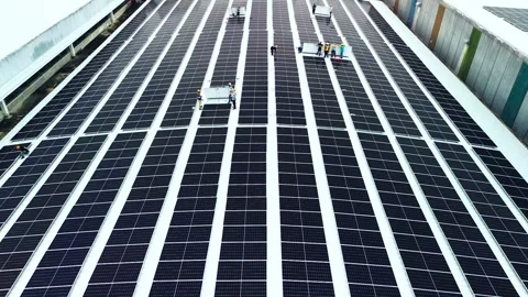Environmentally friendly rooftop energy system installation. Stock Footage 319634690