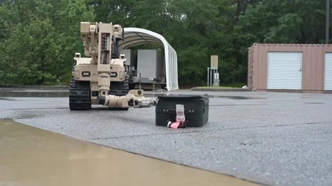 EOD L3Harris multi-mission robot examines suspicious suitcase Stock-Footage 209492591