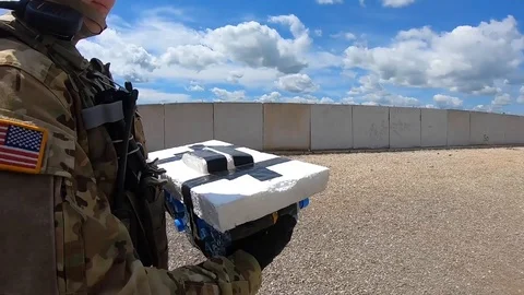 EOD soldier walking with improvised explosive device during training in Kosovo Stock Footage 111947852