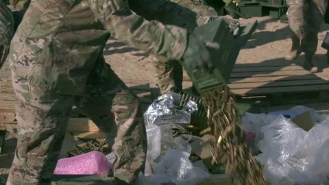 EOD soldiers unloading ammunition from boxes for demolition in Kuwait Stock Footage 84091196