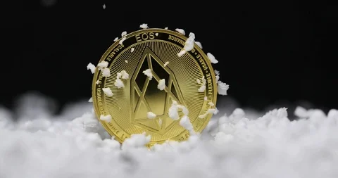 Eos coin poured on with snow Video stock 100692301