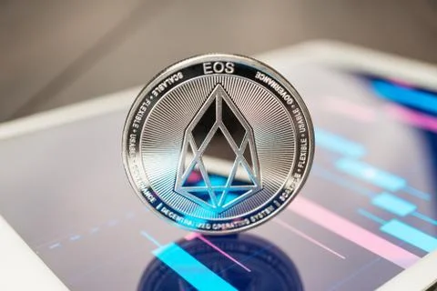Eos cryptocurrency on the tablet Stock Photos