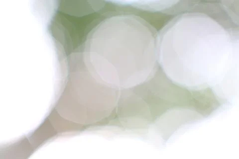 Ephemeral Dance of Light Abstract Background with Soft Green Hues Stock Photos