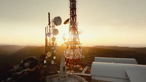 Epic 4K Aerial Drone Orbit around Communication Antenna with sun flare Stock Footage 335119124
