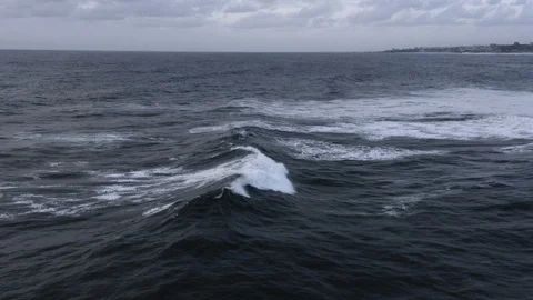 Epic 4k slow-motion breaking wave rolls towards shore at dusk Stock Footage 112693829