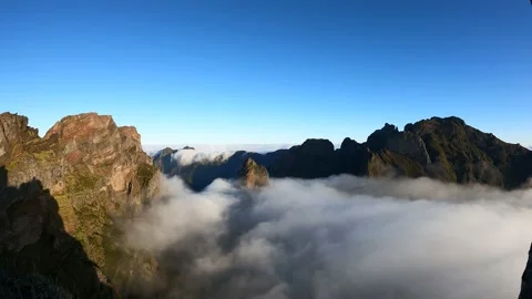 Epic 4K time lapse of a rock in Madeira with moving fog in the mountains. Stock Footage 231347776