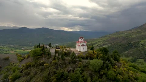 Epic Aerial Drone Flight Around White and Red Church On Top of Hill in Gree.. Stock Footage 334896130