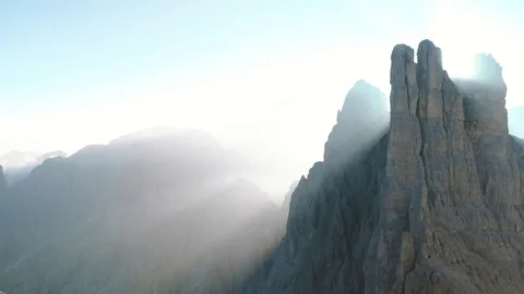 Epic Aerial Drone Shot Sunrays at Vajolet Towers Mountain In Dolomites Italy Stock Footage