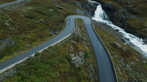 Epic aerial drone shot of two cyclists bikepacking Stock-Footage 185676212