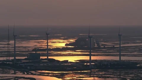 Epic Aerial Drone Slow Motion Windmills Ocean Backbay Water Reflections Sunset Stock Footage 282379778