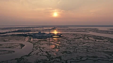 Epic Aerial Drone Slow Motion Windmills Ocean Backbay Water Reflections Sunset Stock Footage 282379780