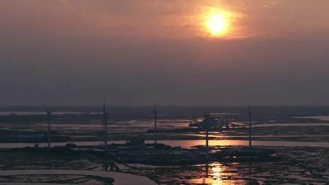 Epic Aerial Drone Slow Motion Windmills Ocean Backbay Water Reflections Sunset Stock Footage 282379787