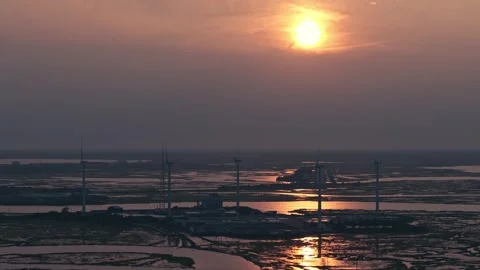 Epic Aerial Drone Slow Motion Windmills Ocean Backbay Water Reflections Sunset Stock Footage 282379788