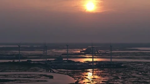 Epic Aerial Drone Slow Motion Windmills Ocean Backbay Water Reflections Sunset Stock Footage 282379790
