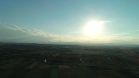 Epic aerial flight over forest and mountains in light dusk mist during sunset Stock Footage 124030026
