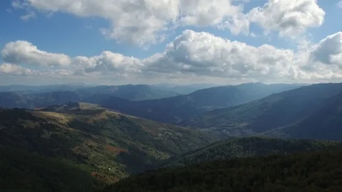 Epic aerial flight over the forest high in the mountains through the clouds Stock Footage 126065415