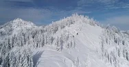 Epic Aerial Flight Stevens Pass Cascade Mountain Top Peaks Blue Sky Stock Footage
