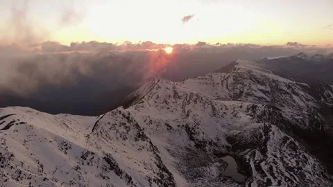 Epic Aerial Flight Through Mountain Clouds Towards Sunrise Stock Footage 162831978