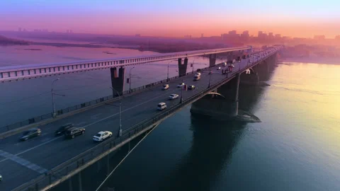 Epic aerial flight view of sunset in a big city on the river. The movement of Stock Footage 132817817