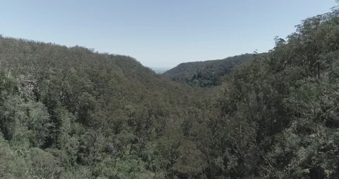 Epic aerial flyover between green mountains and blue sky 스톡 동영상 97416742