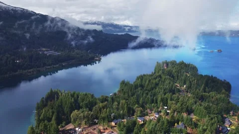Epic aerial hyperlapse of mist rising from conifer forest over Nahuel Huapi Lake Stock Footage 334175172