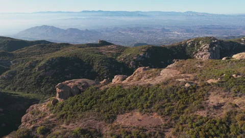 Epic aerial over rolling hills and boulders near Sandstone Peak in the Santa Stock Footage 345528461