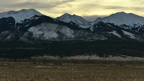 Epic Aerial Push-In and Rise Toward Snowy Mount Blanca Summit - Colorado Stock Footage 323923539