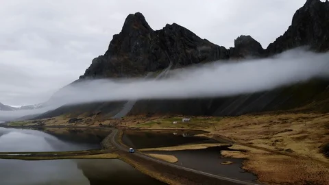 An epic aerial shot of clouds across Hvalnes, Iceland. Stock Footage 129920817