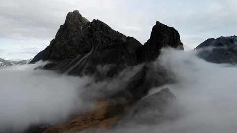 An epic aerial shot, clouds moving across Hvalnes, Iceland. 4K drone. Stock Footage 129920132
