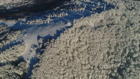 Epic Aerial Shot: Top down view. Beautiful Winter Aerial Flight Over Mountains 動画素材 102045766