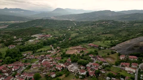 Epic Aerial Timelapse Drone Flight Backwards In Meteora, Greece. Small Vill.. Video stock 334893947