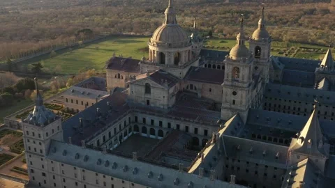 Epic Aerial view of El Escorial Monastery during sunrise. Spain 4K Video Stock Footage 288093059