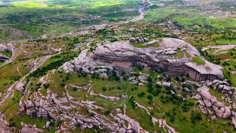 Epic Aerial View of a Lush Green Valley Beneath Dramatic Clouds 스톡 동영상 341243792
