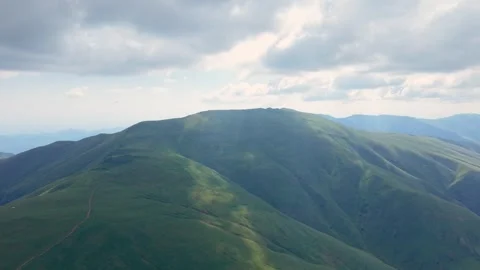 Epic Aerial View of Midzor Peak Green Slopes and Hiking Trail Stock Footage 338354610